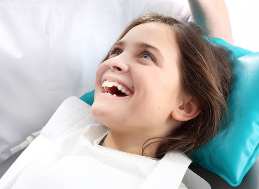 girl smiling big at dentist